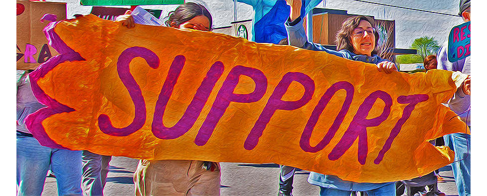 a poster with the text Support as displayed at a protest march Venceremos in Springdale Arkansas 31 March 2025